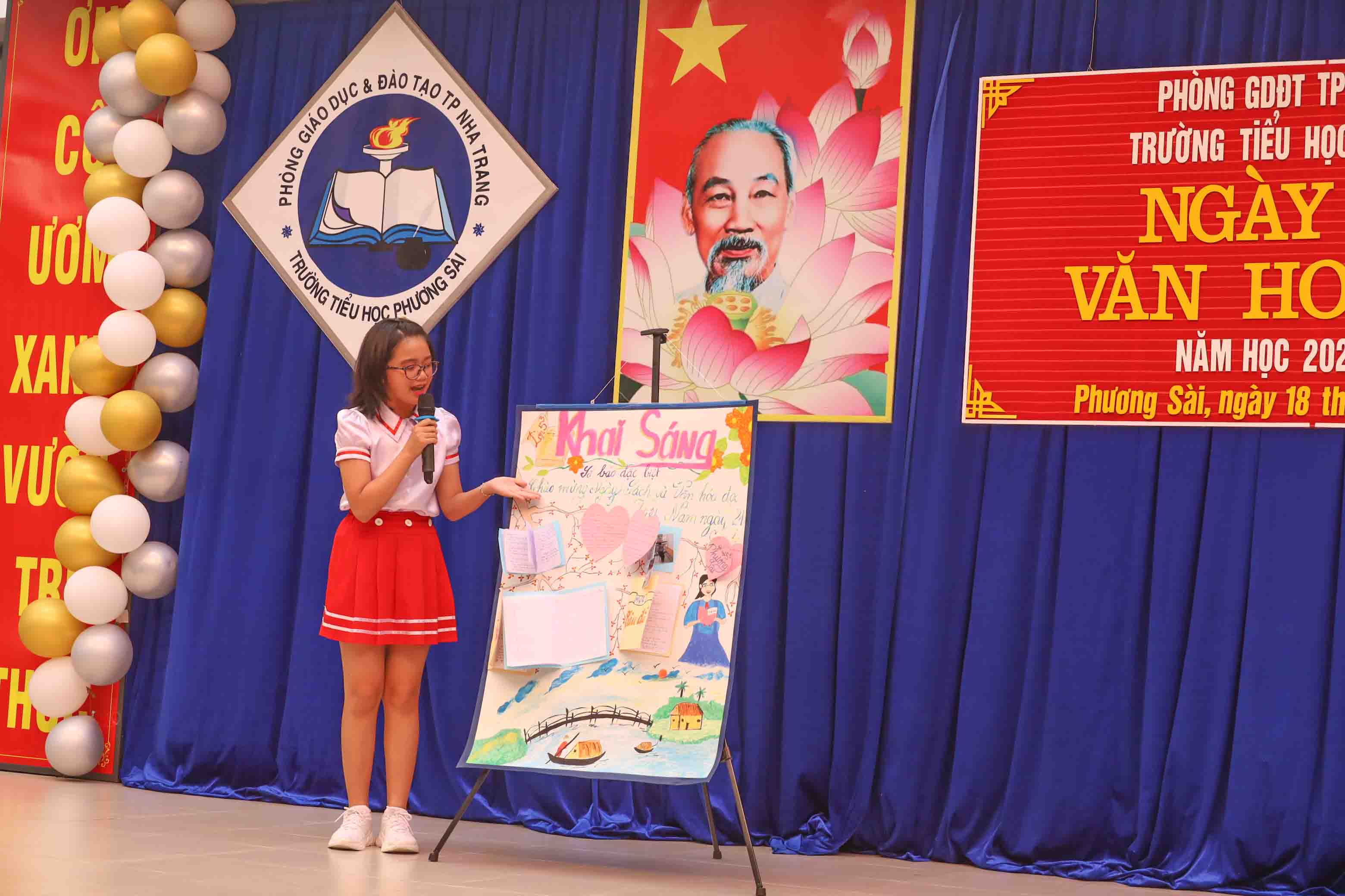 Em Nguyễn Trần Thy Uyên - học sinh lớp 5 thuyết trình về tờ báo tường tuyên truyền văn hóa đọc. 